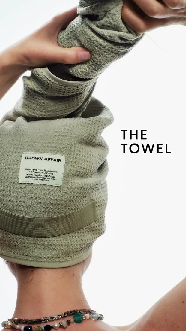 Crown Affair towel still showing hands wrapping the towel around hair